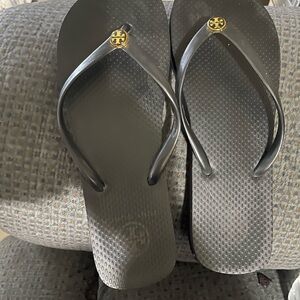 Tory Burch Black Flip Flop Sandals with Gold Logo Medallions